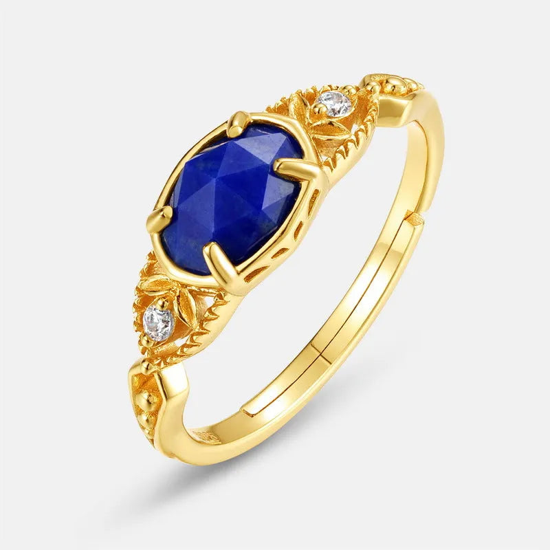 Women's oval geometric ring with blue lapis lazuli stone on a silver-coloured alloy band.