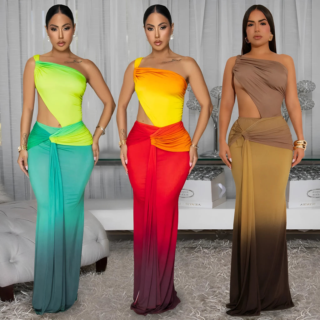 A woman's long gradient dress with a cross-shoulder neckline and high waist, shown in a colour option.