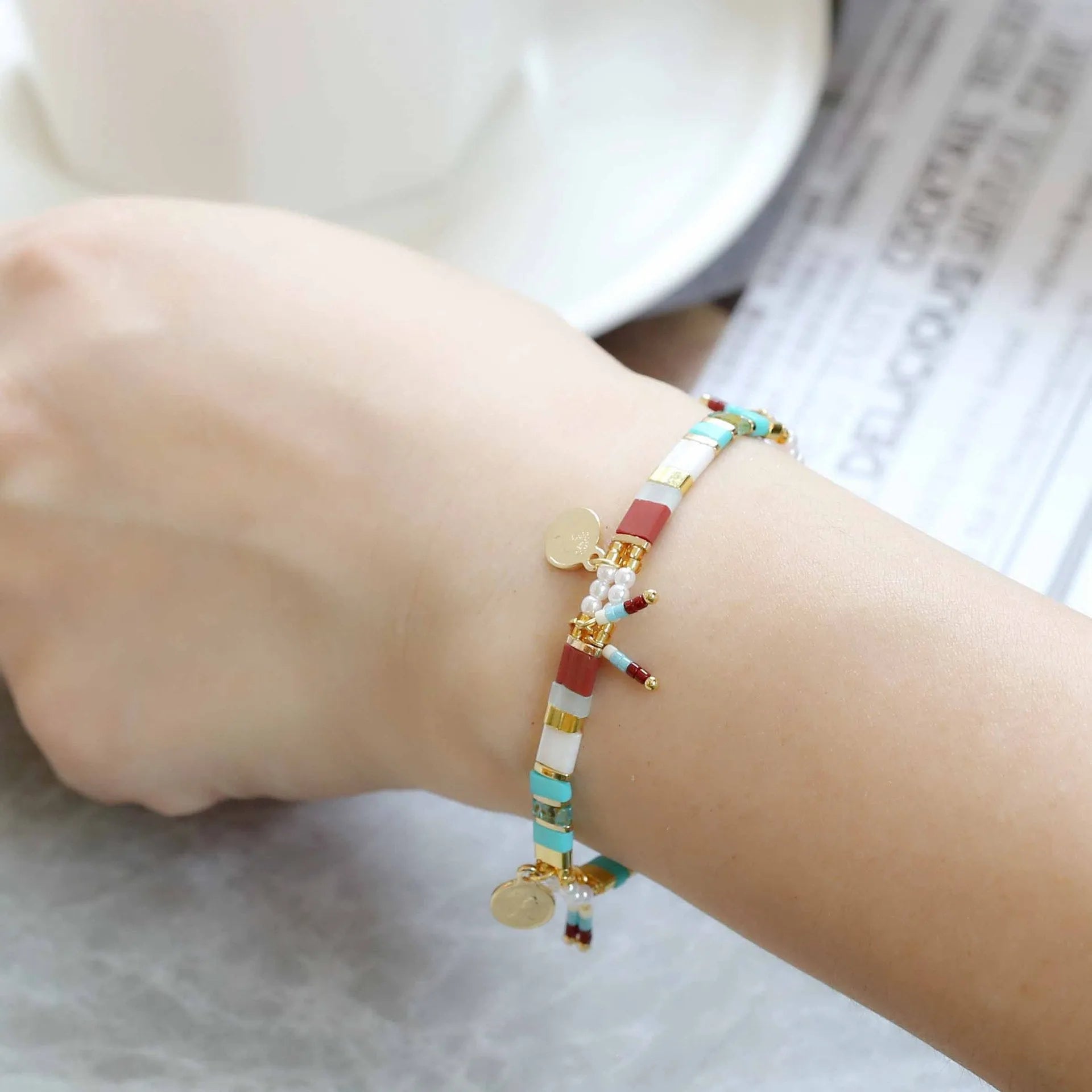 Women's handmade bracelet with imitation pearls and glass coloured beads in original design