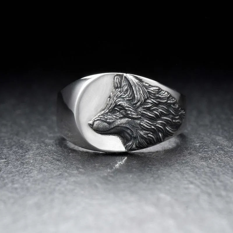 Close up of men's silver alloy ring featuring a geometric wolf head design in retro style
