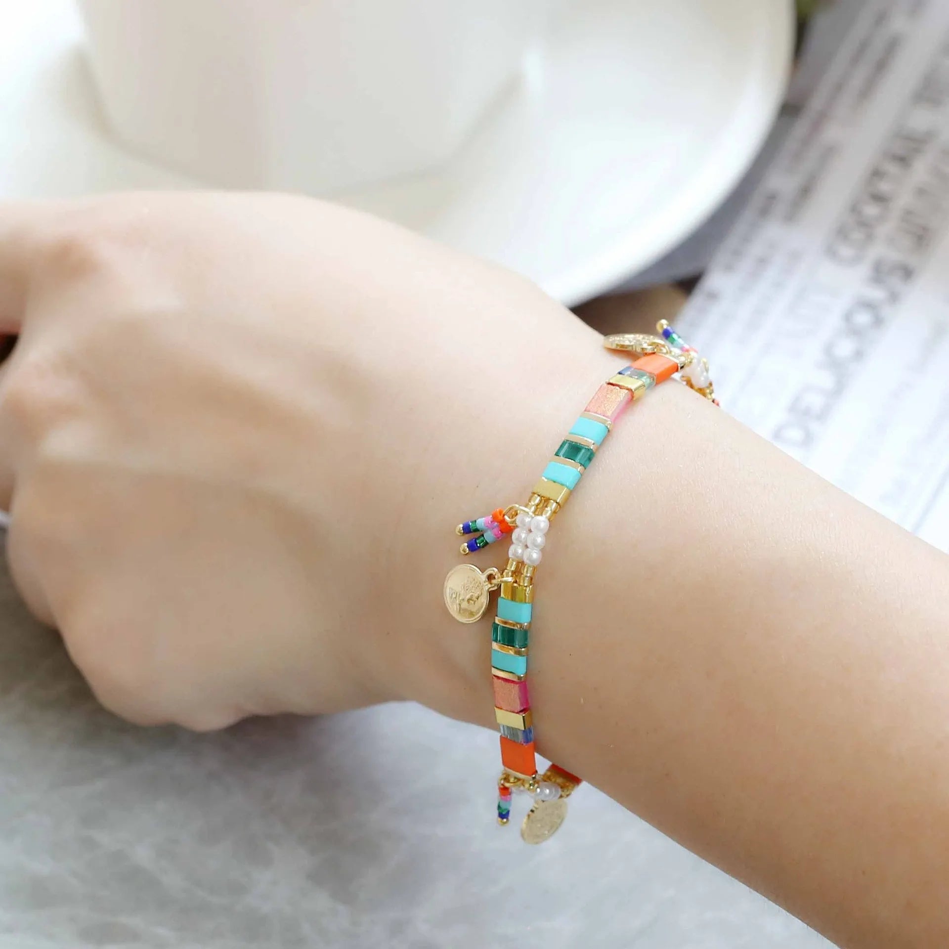 Women's handmade bracelet with imitation pearls and glass coloured beads in original design