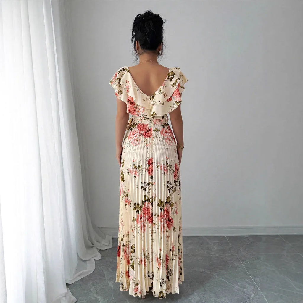 Apricot floral print dress with V-neck, ruffled sleeves, and a swing skirt.