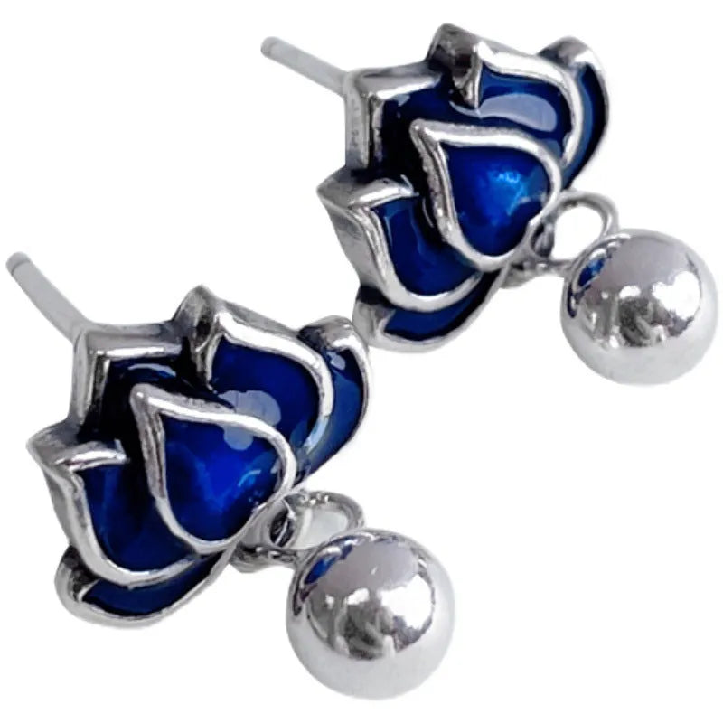 Blue lotus flower stud earrings with a detailed seedpod tassel drop, retro design.