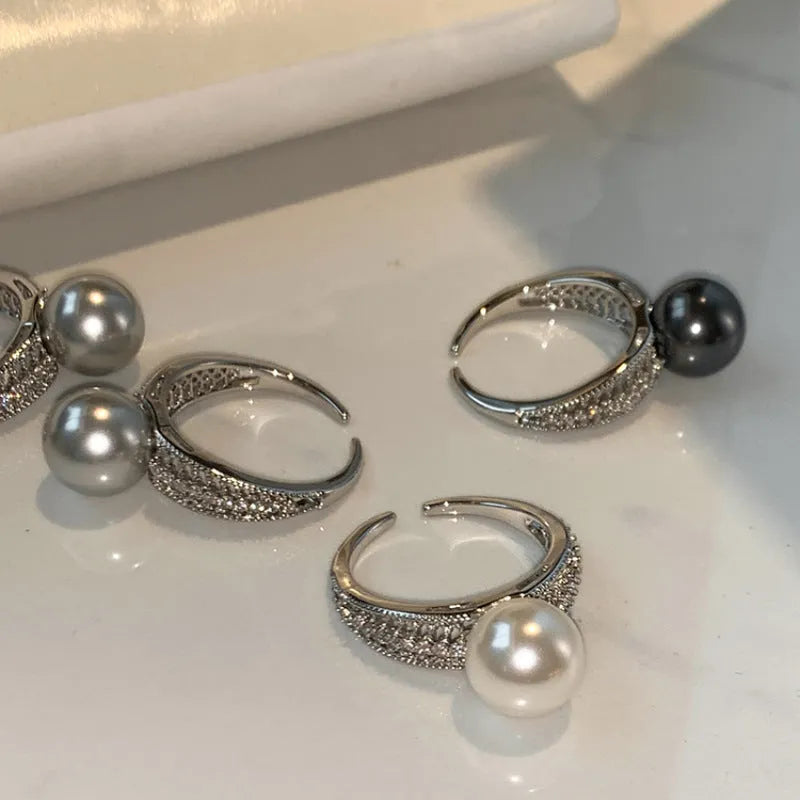 Geometric open ring with black pearl on adjustable copper band for women