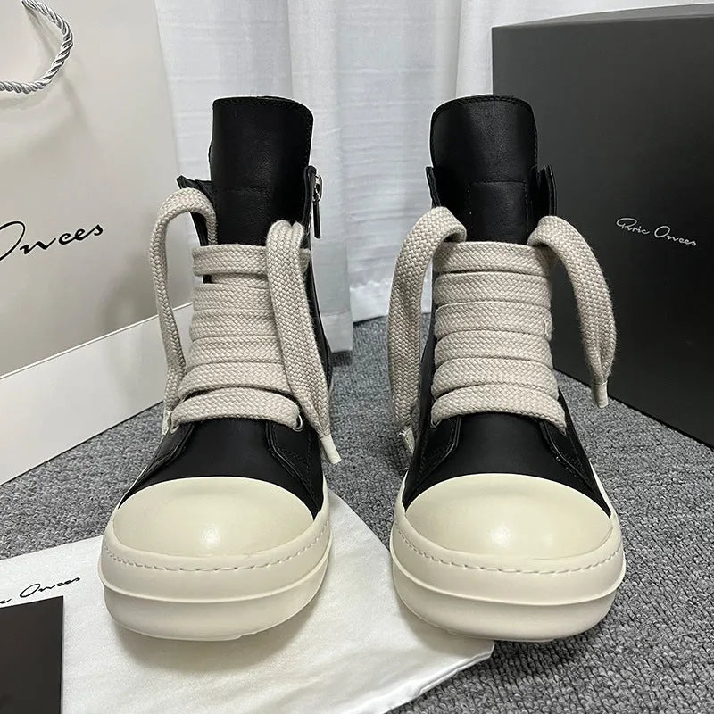 Black genuine leather high-top sneakers with a side zipper on a mid-heel platform sole.