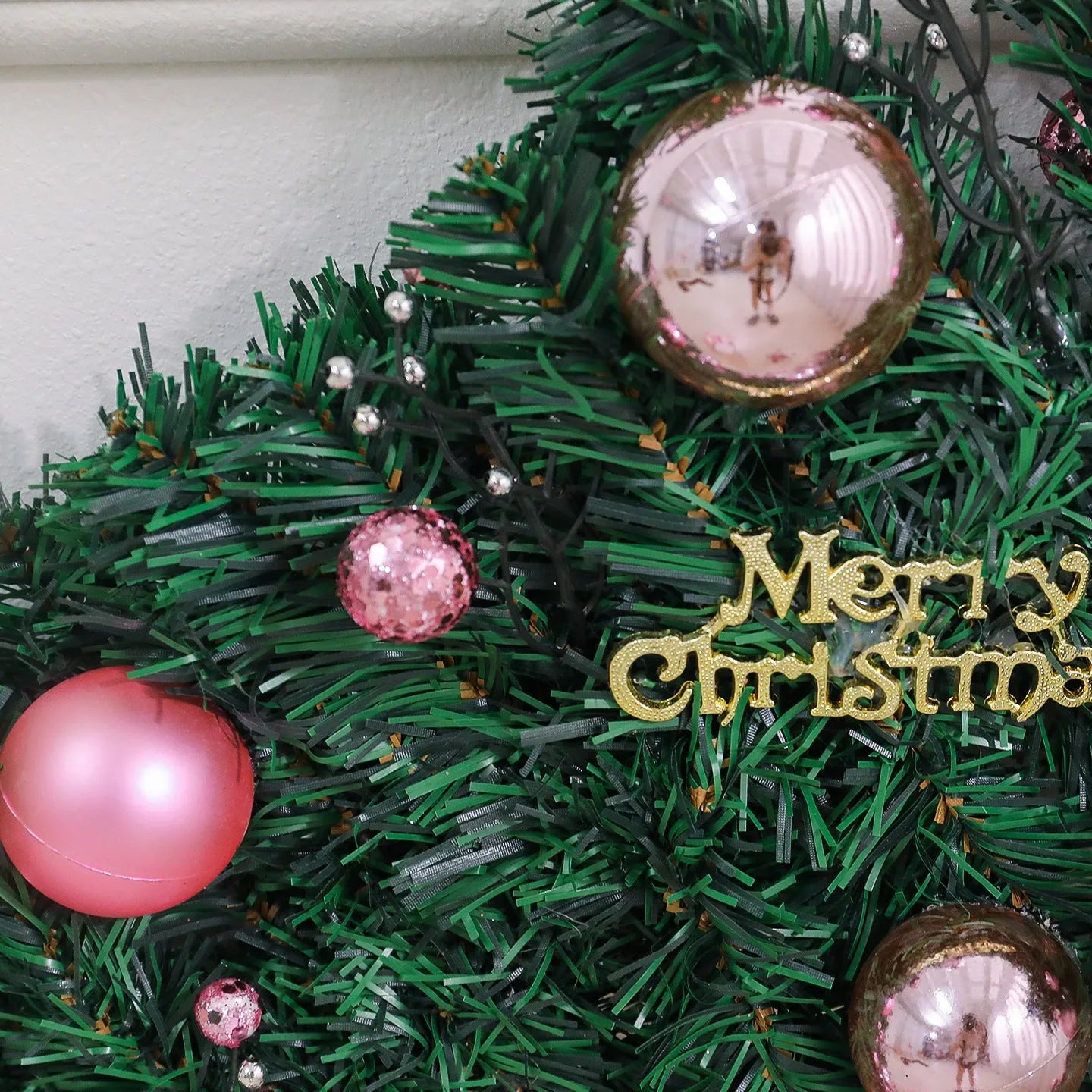 Pink artificial Christmas rattan vine decoration measuring 2.7 metres long with 240 decorative heads