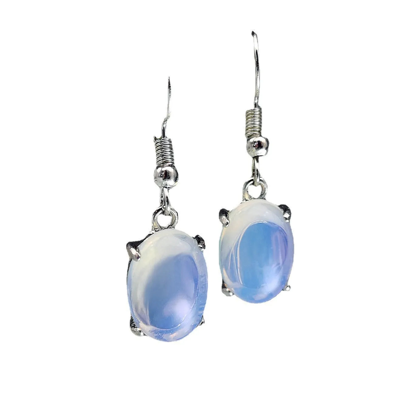 Pair of white retro-style drop earrings with a cross design and opal-like finish.