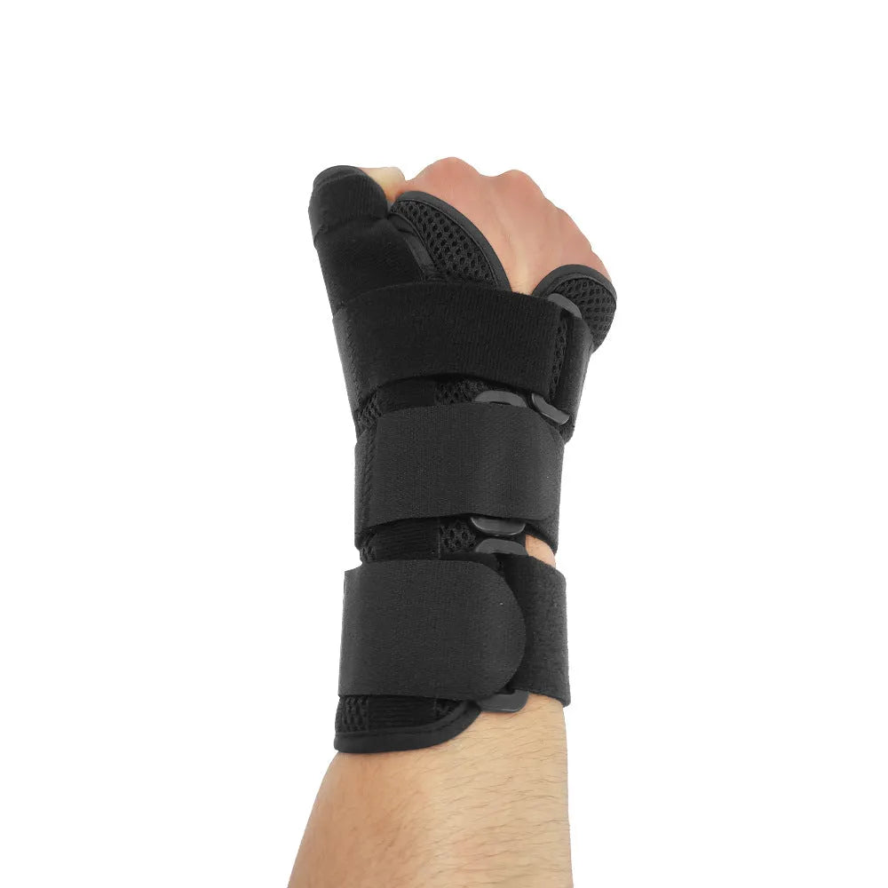 Black carbon fibre sports wrist guard with thumb strap and grey edging for left or right hand wearing