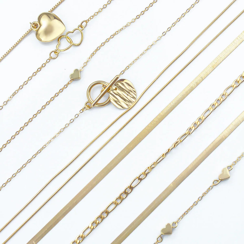 Ten-piece gold women's necklace set with adjustable snake bone chains and alloy pendants