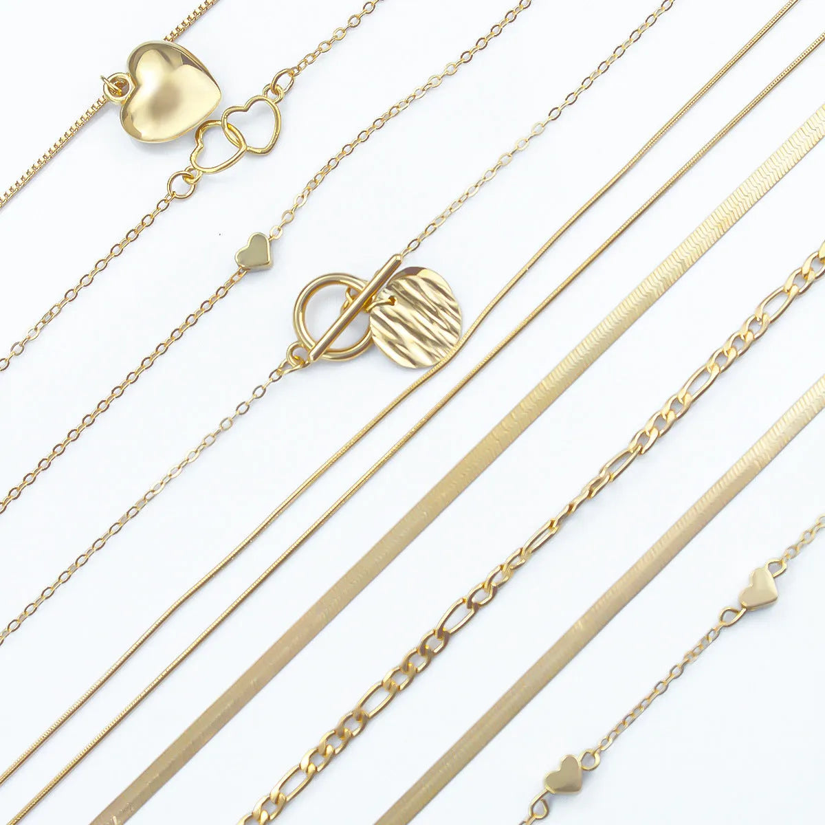 Ten-piece gold women's necklace set with adjustable snake bone chains and alloy pendants