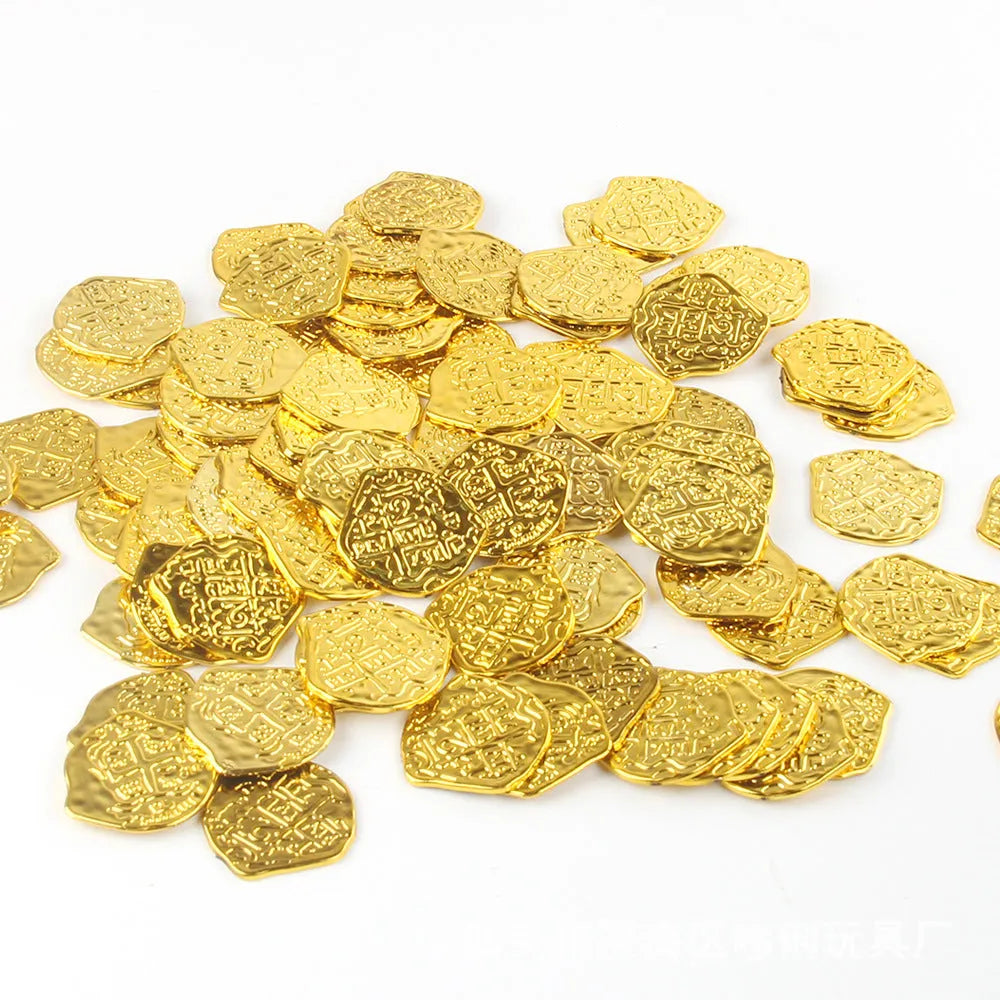 Close-up of detailed plastic Roman pirate coins in bronze, gold, and silver electroplated finishes.