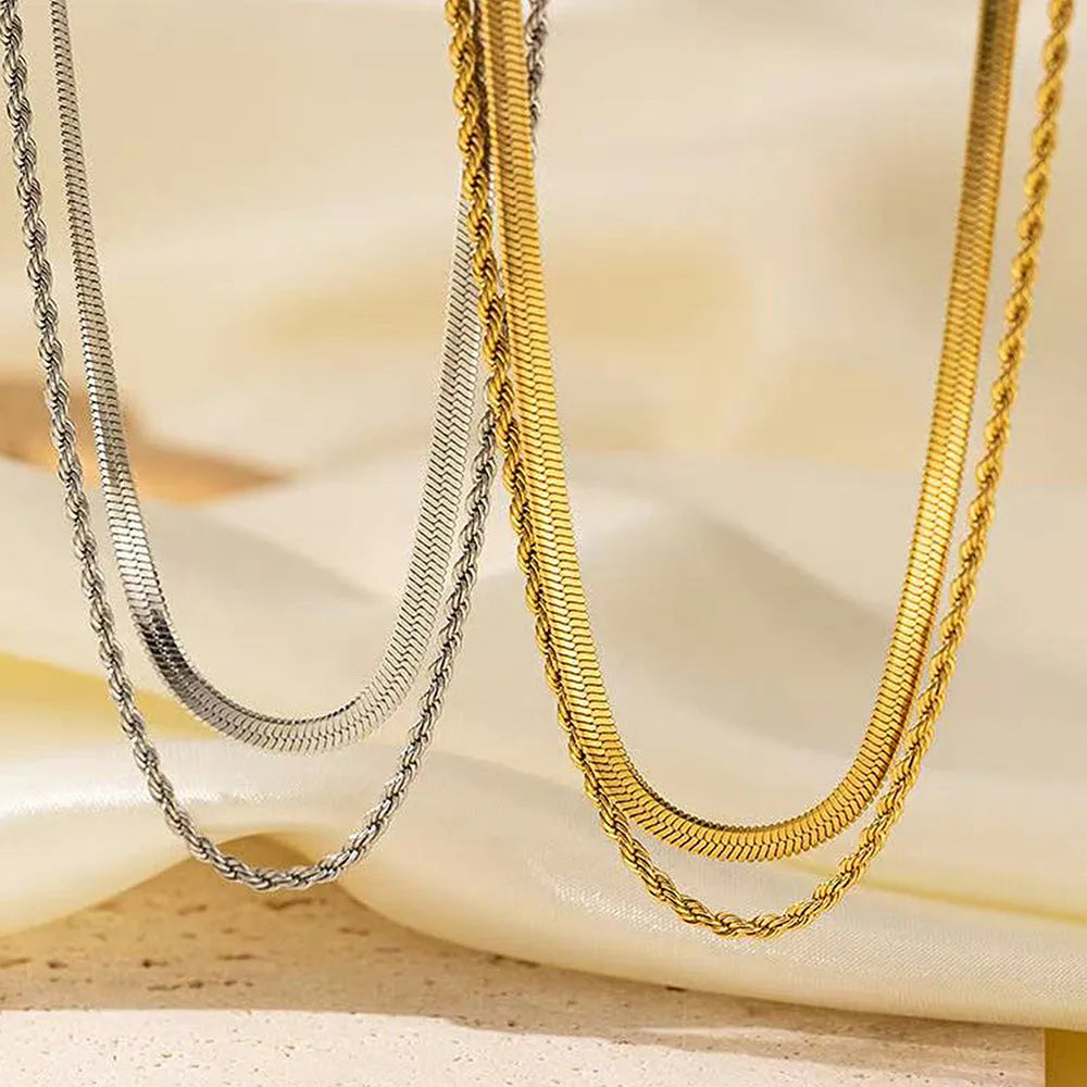 Geometric titanium steel pendant on adjustable snake bone chain necklace showing double-layer twist design
