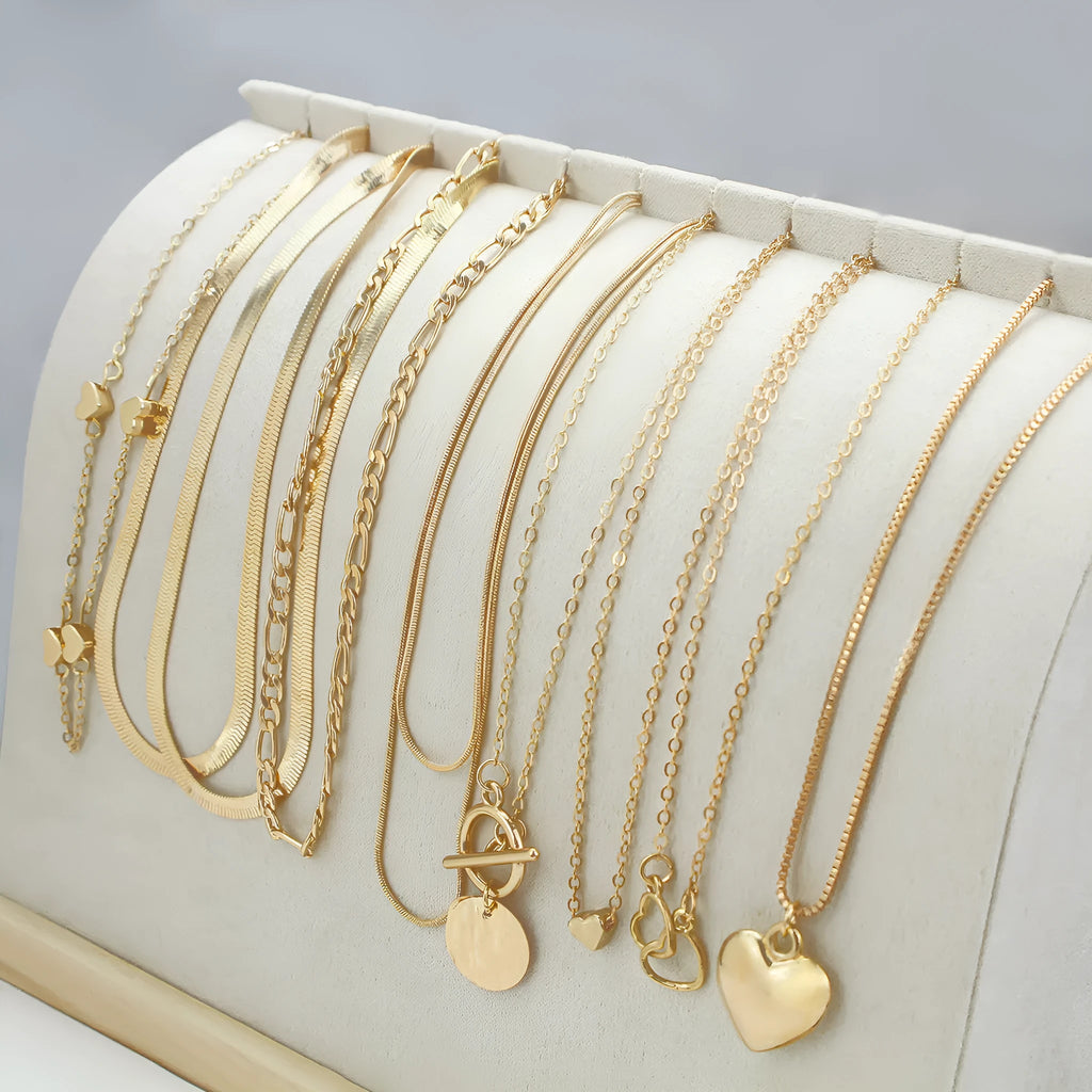 Ten-piece gold women's necklace set with adjustable snake bone chains and alloy pendants