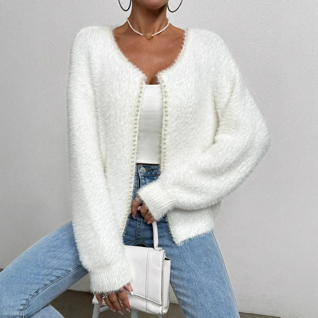 Women's solid white V-neck cardigan with beaded knit detail, shown on a hanger.
