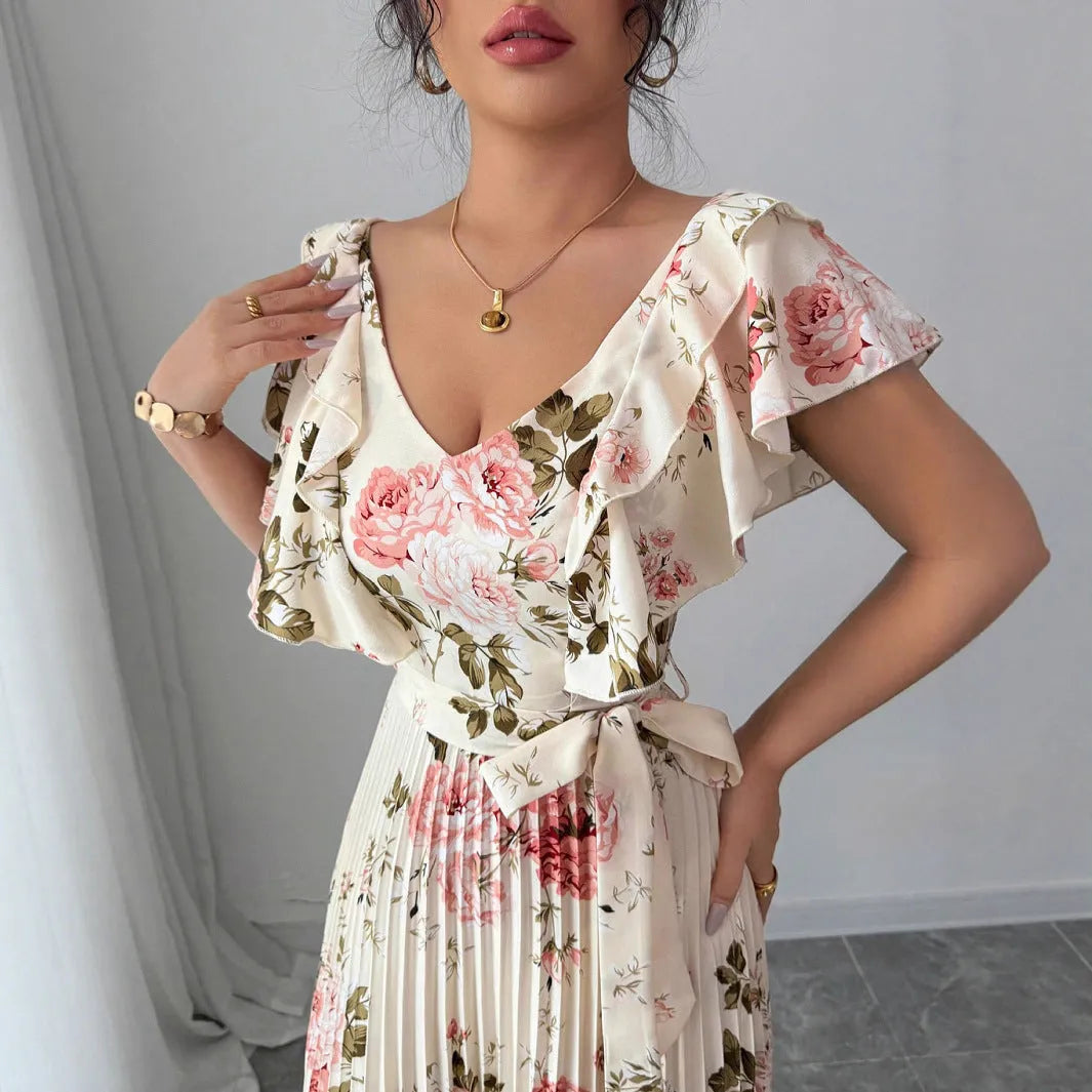 Apricot floral print dress with V-neck, ruffled sleeves, and a swing skirt.
