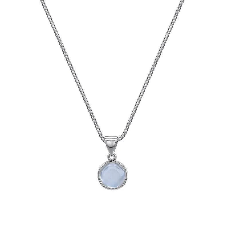 Women's oval geometric pendant necklace with eight awn star crystal on an adjustable box chain.