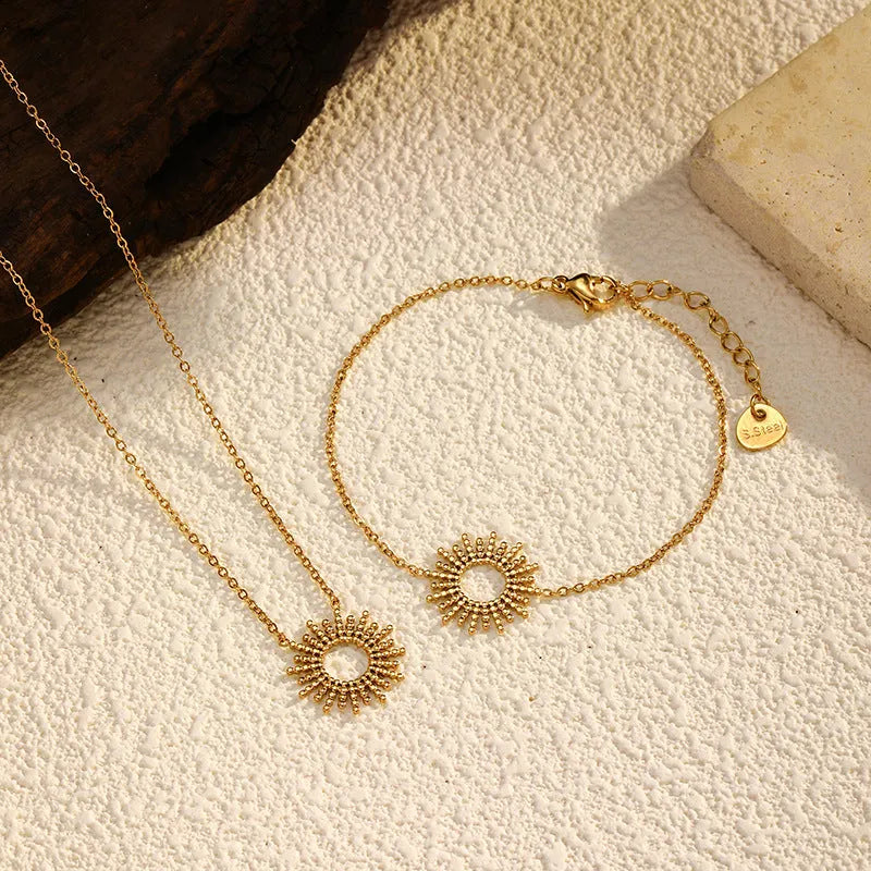 SUNFLOWER Series 14K gold necklace and bracelet set with geometric chain design on white background