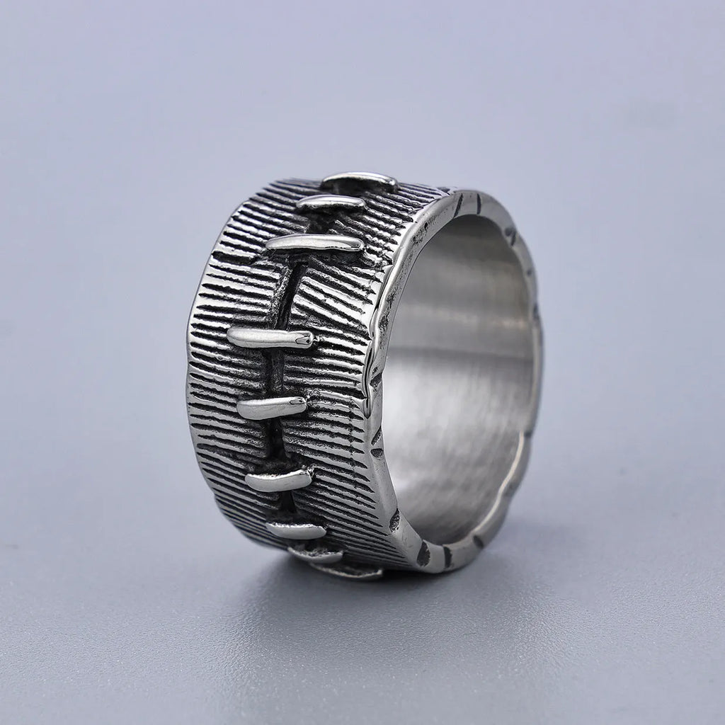 Geometric titanium steel double ring in a dark punk style with a U-shape and stitched design.
