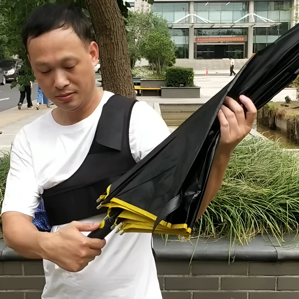 Black portable umbrella holder with a fixed shoulder strap, made from diving cloth, shown holding a manual umbrella.