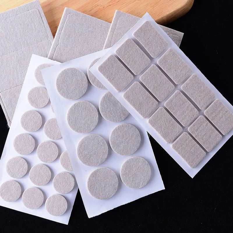 Beige plastic furniture leg protectors showing square and round pads in multiple sizes on a hard floor