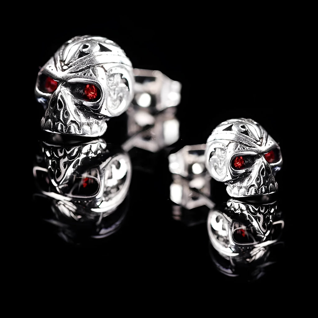 Red eye ghost head skull stud earrings with electroplated alloy construction and artificial gemstone details