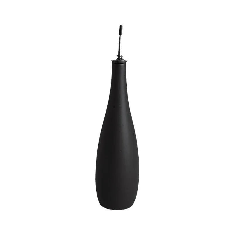 Ceramic oil pot with 650ml conical funnel and integrated oil brush in kitchen setting