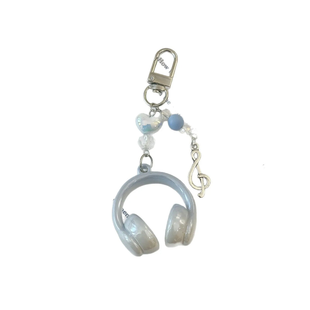 Creative music headset keychain with gradient blue resin earphone pendant and alloy keyring on a plain background