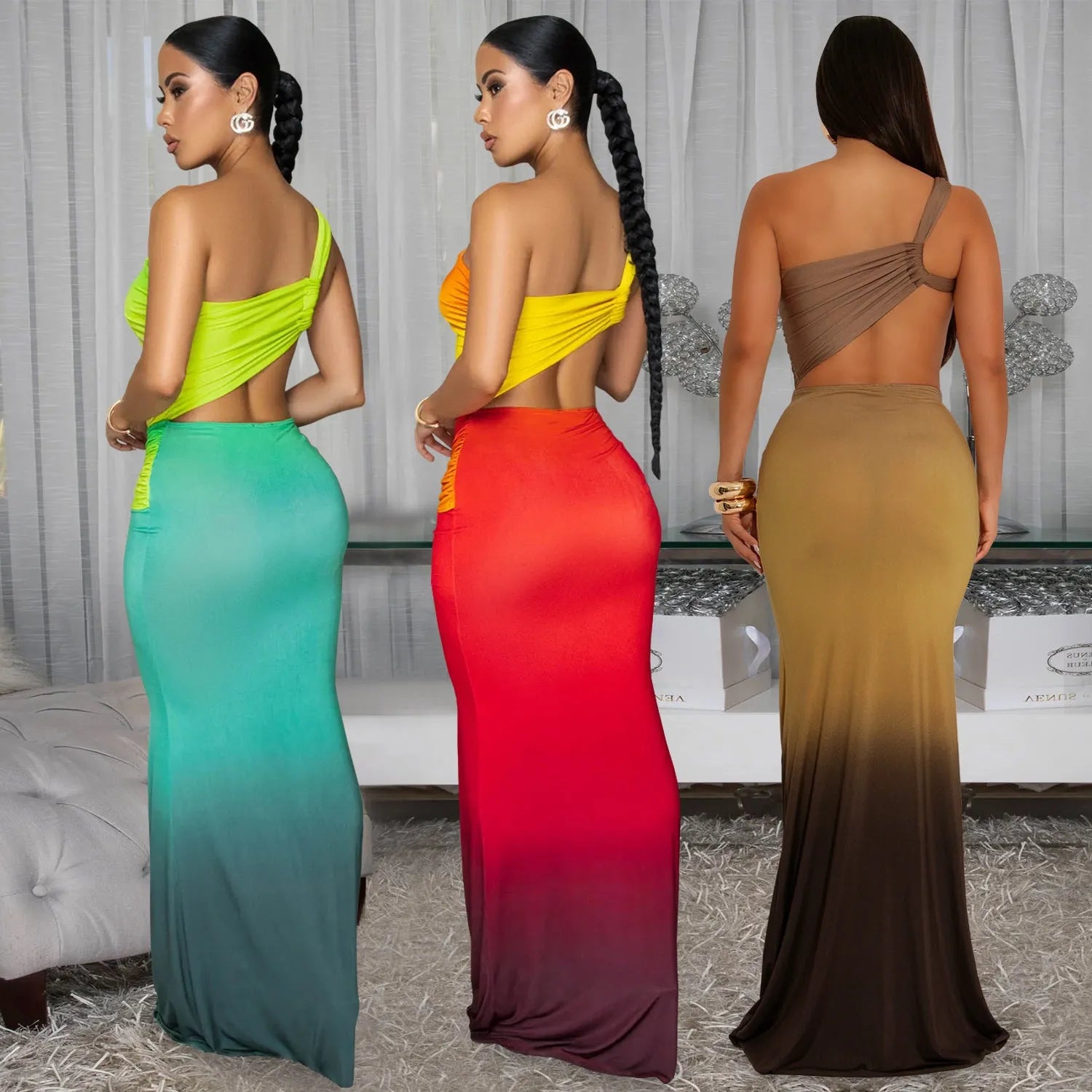 A woman's long gradient dress with a cross-shoulder neckline and high waist, shown in a colour option.