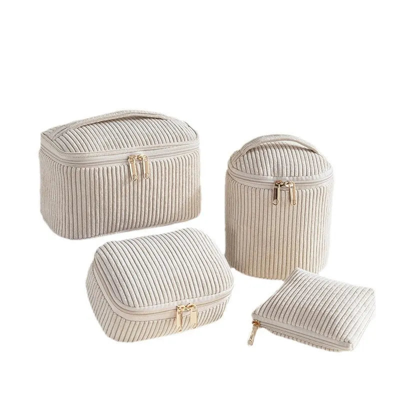 Four cube-shaped flannelette makeup bags in matching blue with dots design