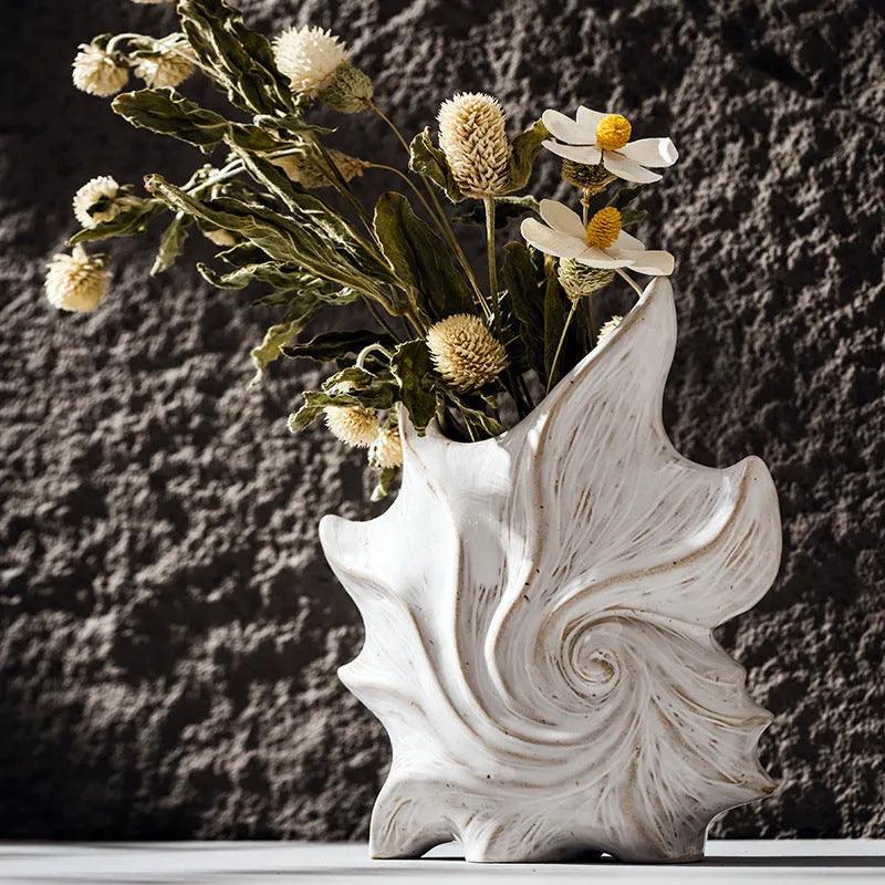 A European style retro ceramic vase with a coloured glaze finish, shown on a shelf.