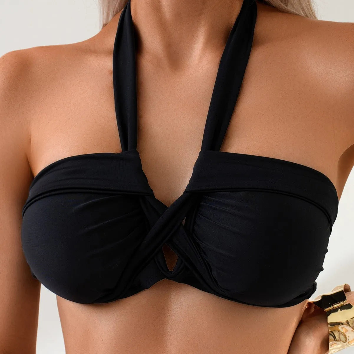 Black backless women's swimming bikini briefs on a white background.