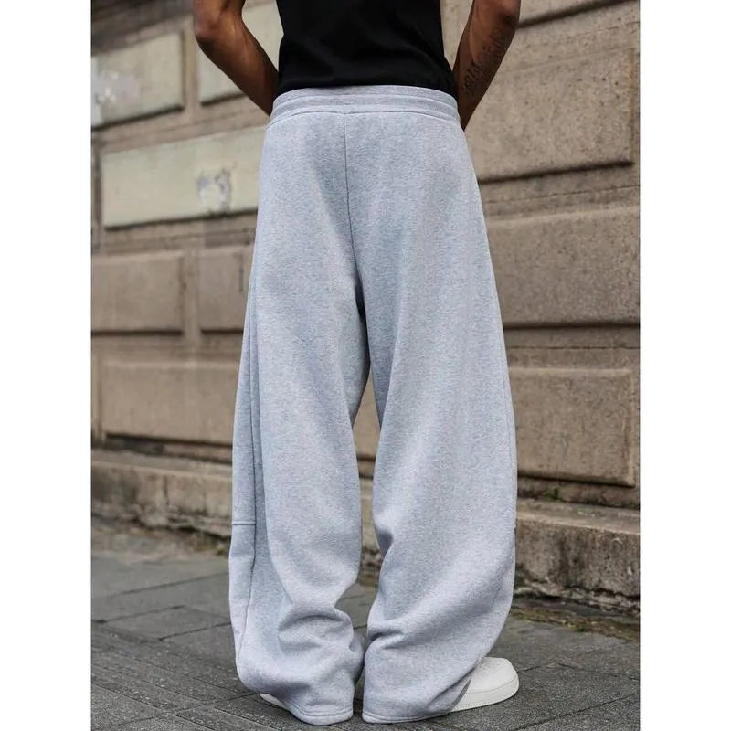 Men's dark grey high-waist straight-leg cropped casual trousers on a hanger.