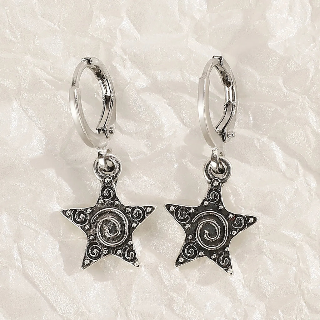 Women's alloy crystal earrings showing five colour options: white cross, white peach heart, white cross, black cat, and antique silver star design.
