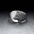 Close up of men's silver alloy ring featuring a geometric wolf head design in retro style