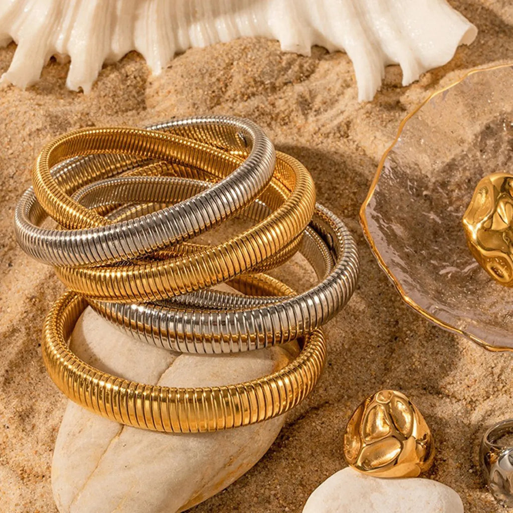 Women's elastic titanium steel bracelet with vertical stripe ring pattern in gold colour
