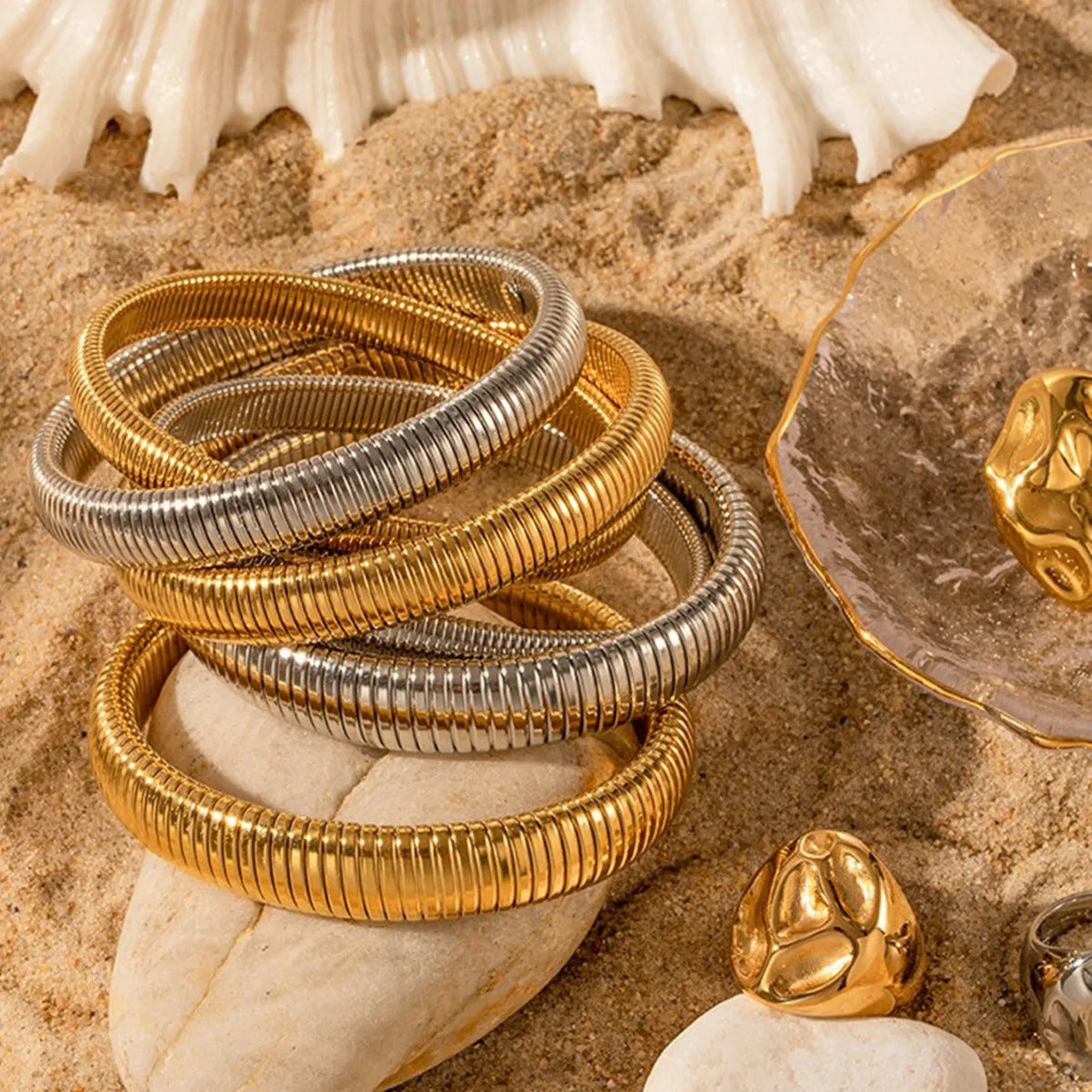 Women's elastic titanium steel bracelet with vertical stripe ring pattern in gold colour