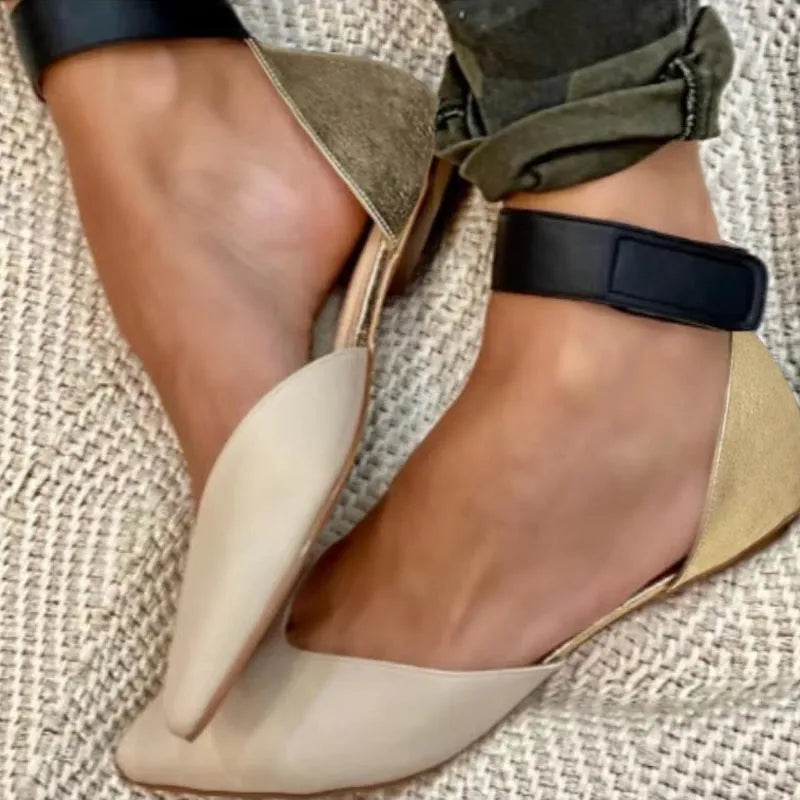 Women's beige casual sandals with Velcro straps and a hollowed pattern on a flat heel.