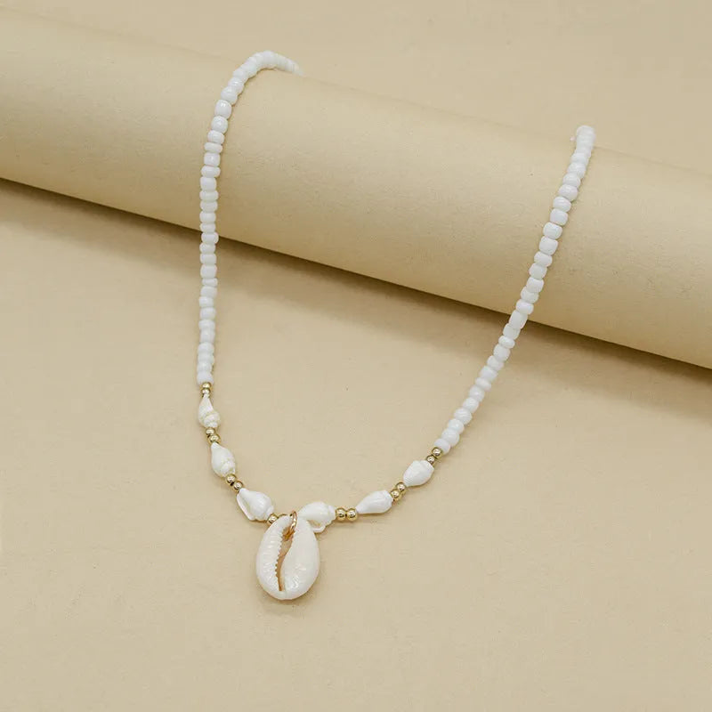 White conch shell necklace with mother of pearl pendant on silver electroplated chain