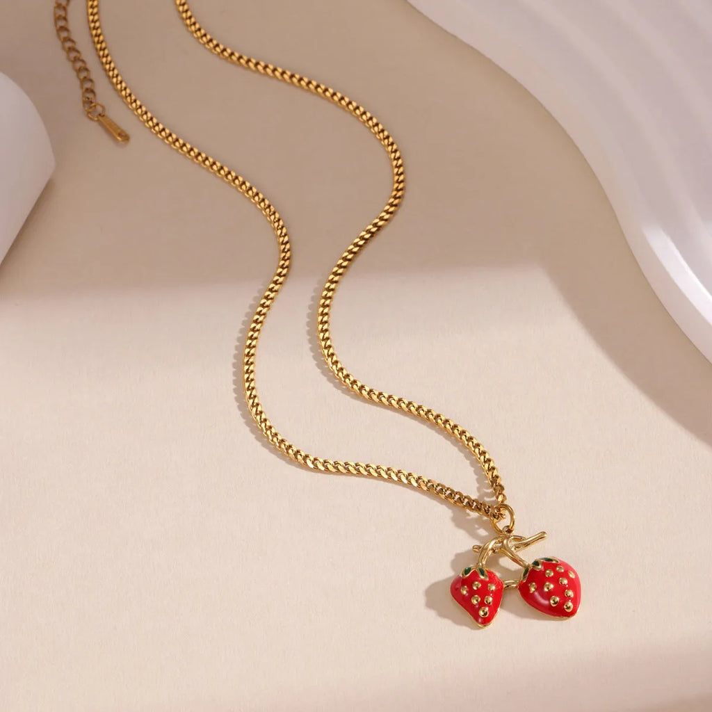 Stainless steel necklace with strawberry fruit pendant in red and white powder gradient colour options