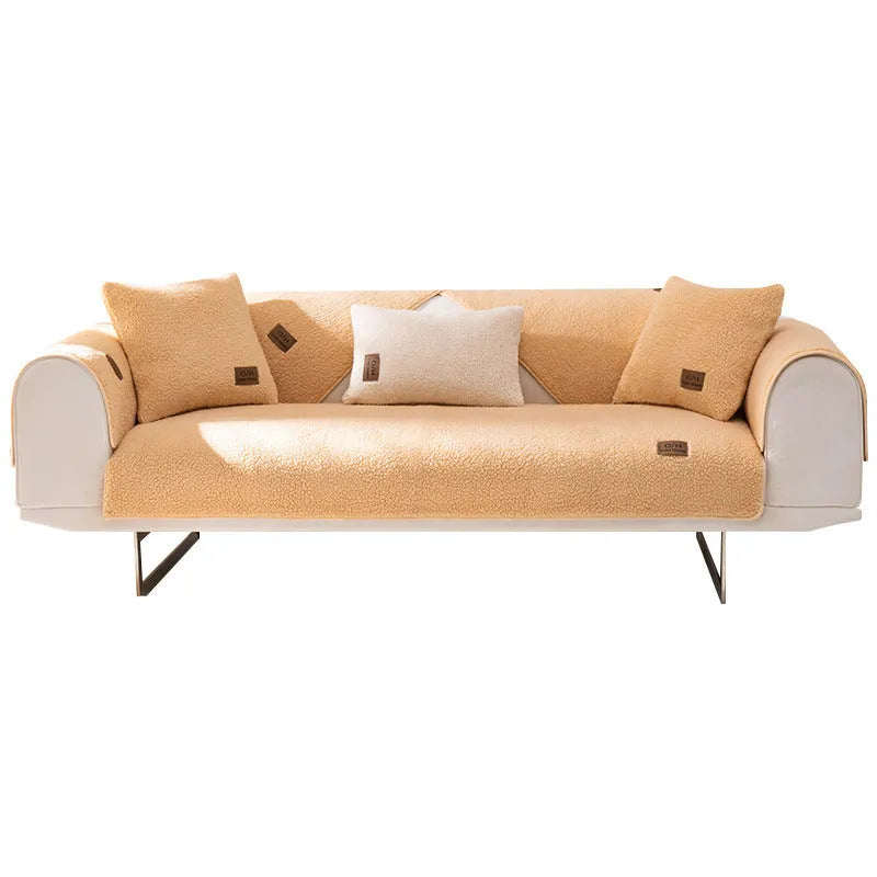 Lambswool solid colour sofa cover in blue on a three-seater sofa