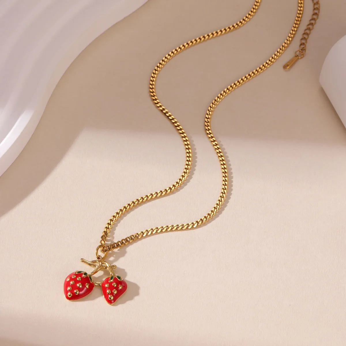 Stainless steel necklace with strawberry fruit pendant in red and white powder gradient colour options