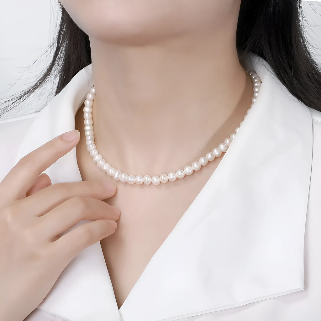 Adjustable women's necklace with natural freshwater pearls on sterling silver chain