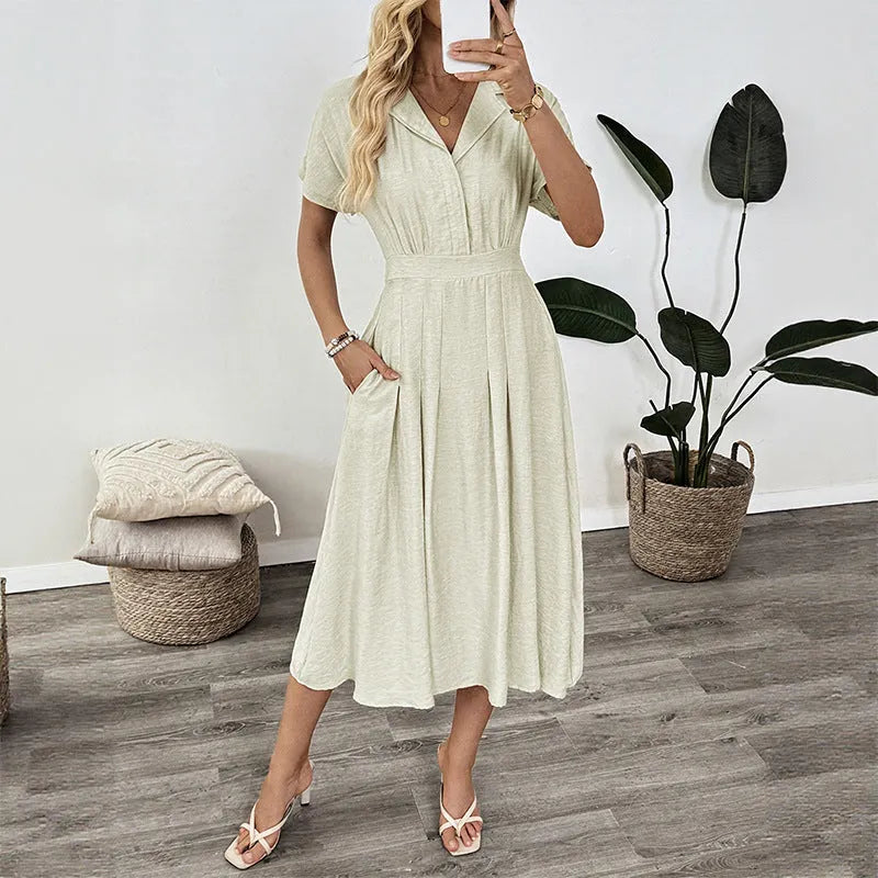 Light green women's shirt dress with lapel collar, waist tie belt, and side seam pockets.