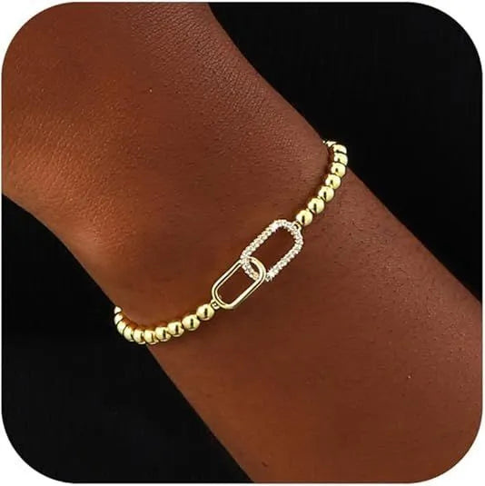 Women's adjustable stainless steel beaded bracelet in a simple geometric shape on a wrist.