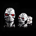 Red eye ghost head skull stud earrings with electroplated alloy construction and artificial gemstone details