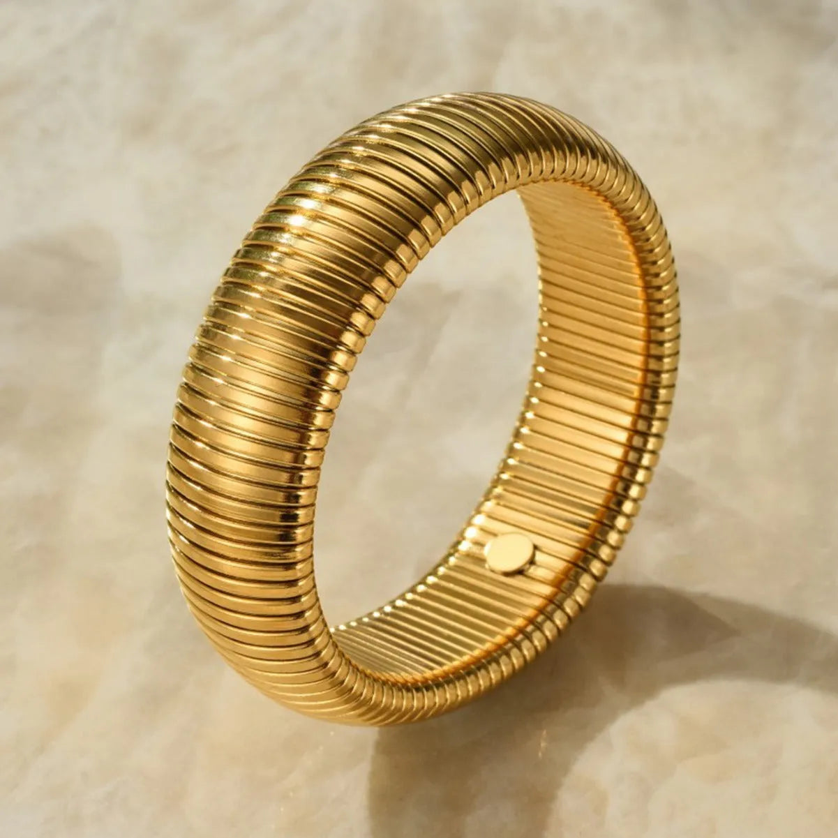 Women's elastic titanium steel bracelet with vertical stripe ring pattern in gold colour