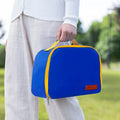 Insulated textured cloth lunch box bag in sapphire blue colour, shown with a lunch box inside.