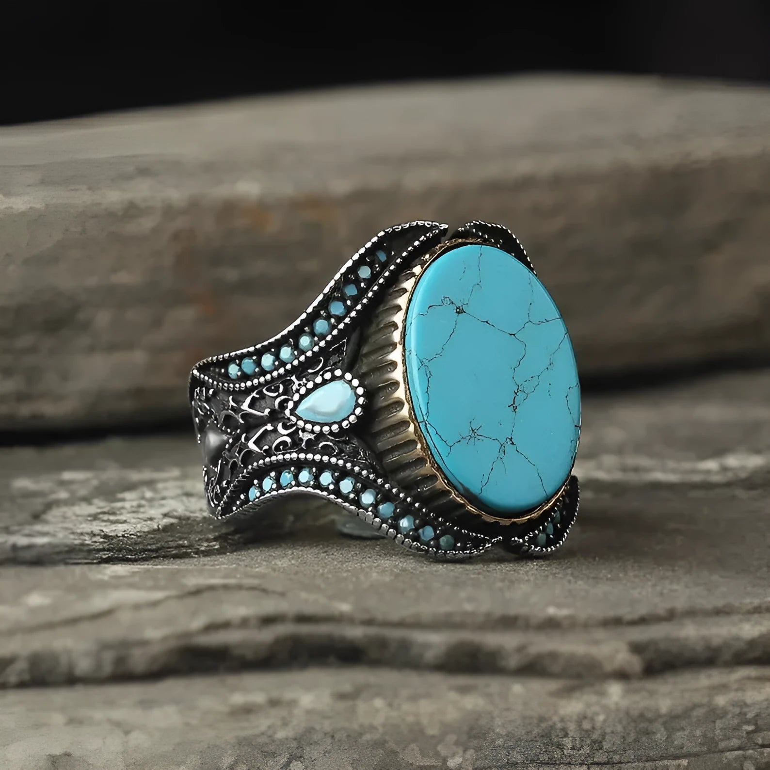 Men's turquoise alloy ring with antique silver finish showing round band design