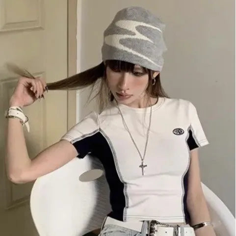 Acrylic thermal knit beanie hat in black, shown on a model, illustrating its textured anti-fall design.