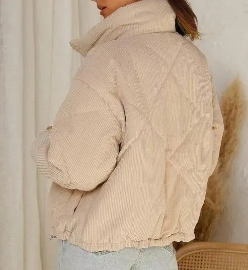 Apricot-coloured women's corduroy jacket with a stand collar and front zipper.